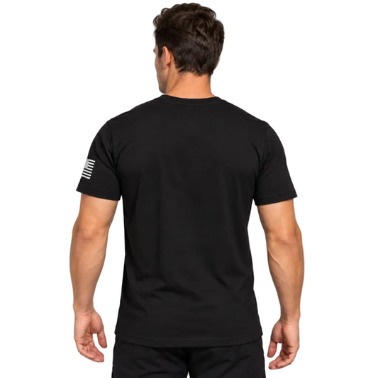 A man viewed from behind wearing a black short-sleeve t-shirt with a white graphic on the left sleeve, set against a plain whitebackground.
