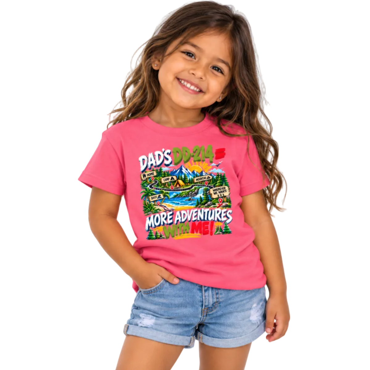 A young girl with long brown hair smiling, wearing a bright pink graphic t-shirt that reads 'DAD'S DD-214 = MORE ADVENTURES WITH ME!' above a colorful cartoon landscape, paired with denim shorts, against a plain white background.