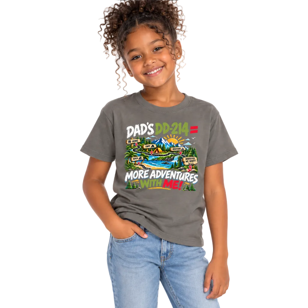 A smiling young girl with curly hair wearing a dark gray graphic t-shirt that reads 'DAD'S DD-214 = MORE ADVENTURES' with a colorful outdoor scene, paired with light blue jeans, against a plain white background.