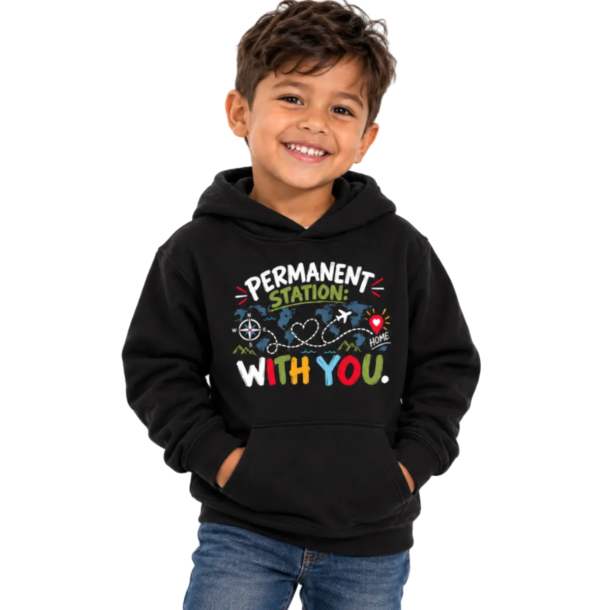A smiling young boy wearing a black pullover hoodie with a colorful graphic that reads 'PERMANENT STATION: I'M WITH YOU.' and blue jeans, photographed against a plain white background.