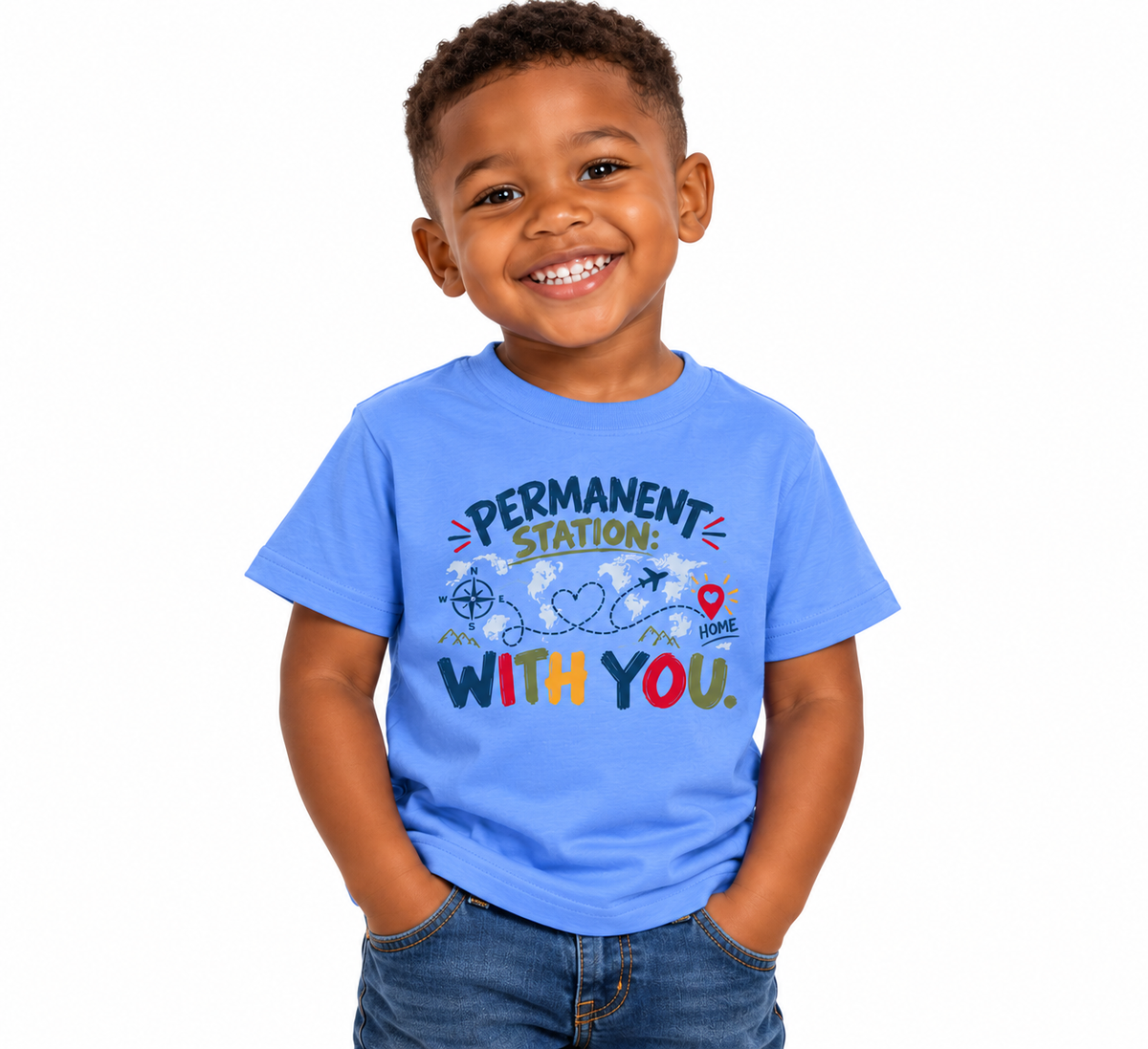 A smiling young boy wearing a bright blue graphic t-shirt that reads 'PERMANENT STATION! WITH YOU.' in colorful lettering, paired with blue jeans, set against a plain white background.
