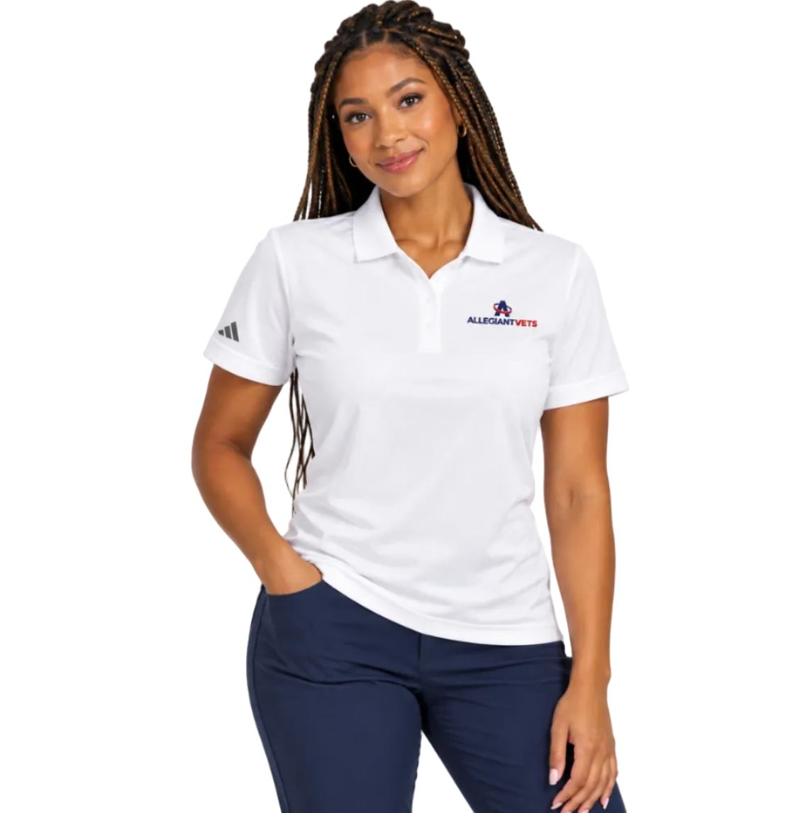 A woman modeling a white short-sleeve polo shirt with a small embroidered logo on the left chest and a black logo on the right sleeve, paired with navy pants, against a plain white background.