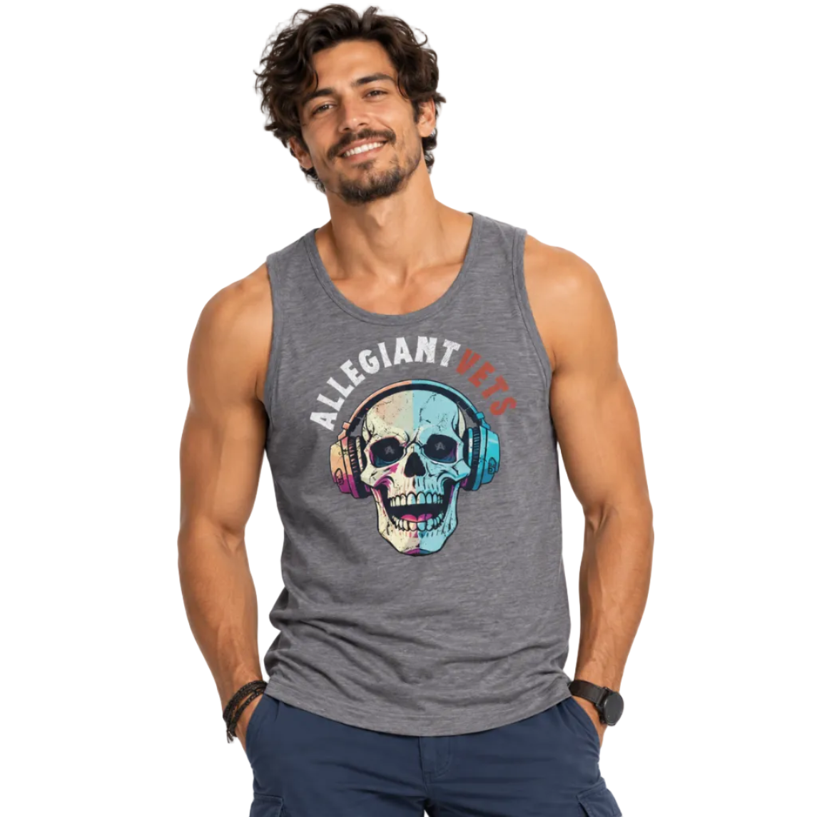 A smiling man wearing a heather gray sleeveless tank top with a colorful skull graphic wearing headphones and the text 'ALLEGIANTVETS' across the chest, paired with dark blue pants, against a plain white background.